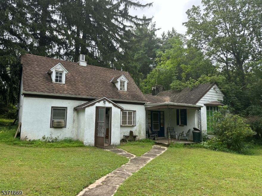 Rare opportunity in desireable Hillsborough to bring your vision to life in a sought-after location. This property (.85 ACRE) is a blank canvas with loads of potential perfect for investors or contractors. Home includes solid cedar closets.Home is being sold strictly "AS IS, WHERE IS." No repairs or credits will be offered. Buyer is responsible for obtaining the smoke certificate. Features include a detached 4-car garage with electricity (built 1991/1992). House has surveillance.