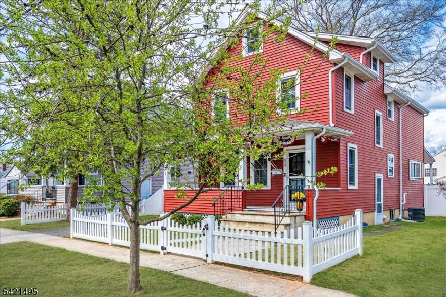 Charming Colonial, offering timeless character and updates in a Prime Dunellen location. Relax on the inviting front porch before entering the spacious living room showcasing original chestnut wood trim and elegant crown molding. The 1st level features a formal dining room with chandelier, arched entryways and a convenient laundry room with half bath. The eat-in-kitchen is designed for both function and style featuring a center island, granite countertops, solid, wood cabinetry, recessed lighting, imported tile backsplash and luxury vinyl flooring with direct access to the rear porch & backyard. Ideal for everyday living and entertaining. The 2nd floor level offers 3 bedrooms, 2 full bath  one with a jetted tub. The primary suite includes a private full bath, generous closet space, an additional flexible room perfect for a nursery, office or sitting area. A full walkup attic with two additional rooms provides endless possibilities. A full basement with interior and side entrance access offers open space ready for customization, along with bilco doors, a new furnace, (2025) water heater (2023), newer windows, 150-amp electrical panel. The outdoor space is equally impressive featuring an above-ground pool, storage shed, vinyl fencing for privacy, and a covered rear porch with extended deck - perfect for entertaining. Conveniently located near New Jersey transit, bus and train lines, downtown Dunellen, restaurants, house of worship and so much more. Garage is Sold As Is.