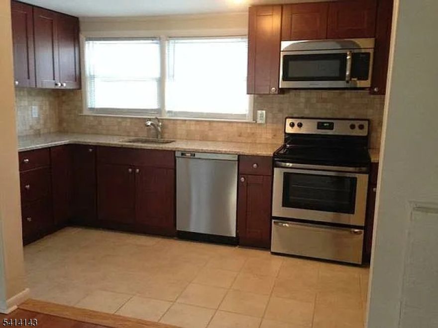 Large Updated 2 Bedroom Ground Floor  Apartment w/ 1 Car GARAGE  In Desirable Shongum Section! Minutes To Morristown! Hardwood Floors, Central AC,  Large Private Backyard, Great Location For The Everyday Commuter! Spacious Rooms! Washer & Dryer In Basement   NO SECURITY DEPOSIT OPTION!   Great Rental! Must See!!!