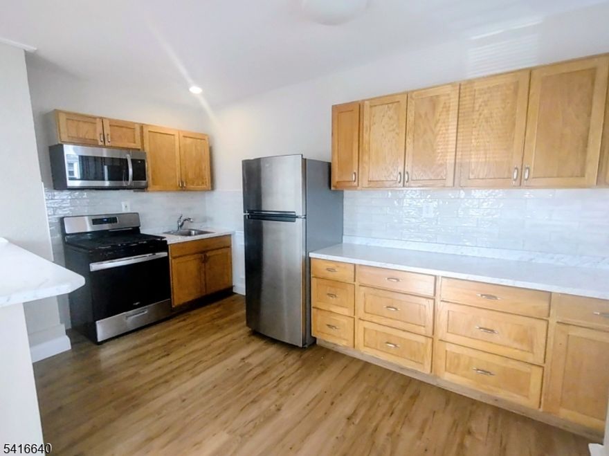 Welcome home and move right in to this stunning and immaculate 1 bedroom, 1 bath, 2nd floor apartment with a BONUS ROOM perfect to use for an office! Almost everything in this unit is NEW NEW NEW!! Completely updated with all new appliances...air conditioner, ceiling fans with remote, recessed lighting, new windows with blinds, modern kitchen with newer cabinets offering tons of storage space, bathroom with sleek finishes and much more...attention to details galore! Sun-drenched and conveniently located near the Silver Lake Light Rail Station and Bus for an easy commute to NYC, Newark Business District, Seton Hall Medical School, Clara Maas Hospital and surrounding colleges! Gated driveway for 1 off-street parking spot for an additional $50 per month, shared laundry room INCLUDED in the rent, landlord pays for electricity/water for laundry only. No pets, no smoking! Landlord takes care of building maintenance and snow removal for property, tenant pays utilities and responsible for snow removal around their own vehicle. Close to schools, shopping and restaurants. Available immediately!