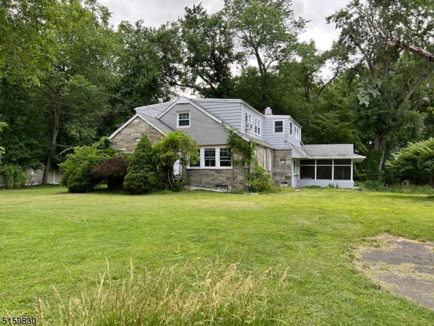 Ideal for Contractor, Landscaper, Gardner - 2.5+ Acres of land boasting one 2 car garage detached and one auxiliary building plus large 4 bedroom home with enclosed porch. Large level expansive lot with home that sits back off the road - home in need of some love but renovations have been addressed with kitchen and bathroom. Home sold as-is. Amazing opportunity to add a little bit of sweat equity and have 2.5+ acres of house and home. Property located in the flood zone.