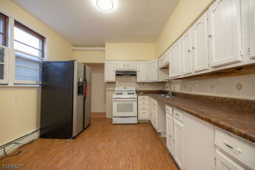 Excellent income-producing opportunity. Spacious side by side multi family offering a total of 9 Bedrooms and 3 full baths, plus an attic for space storage. Nicely located near schools, with easy access to bus transportation to New York City and shopping conveniently within walking distance.