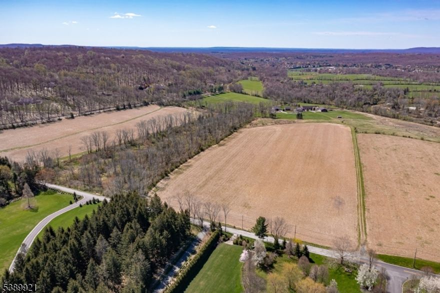 This stunning pastoral acreage offers a rare opportunity in the Roxiticus Valley. The 64 +/- preserved acres boast scenic views over the valley and to the distant rolling hillsides. The property has frontage along East Fox Chase Road in Chester and Roxiticus Road in Mendham.There is a two-acre exception area for a future dwelling. Build your dream home surrounded by natural beauty in the heart of a treasured Morris County estate area. This gorgeous acreage and sought-after location provides  several "use options  for a buyer including equestrian, farming and many other types of agricultural / recreational uses. This serene setting is about 45 miles from midtown Manhattan and a short distance from local highly ranked public and private schools, shopping, dining, parks, interstate highways and international airports.
