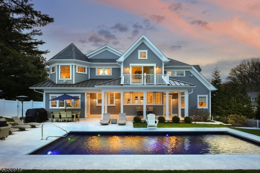 Welcome to this exceptional Indian Forest residence built from foundation up in 2018. With 5 spacious bedrooms & 6.1 designer baths spread across 3 meticulously crafted levels, this home is the epitome of modern elegance & comfort. A covered Ipe wood front porch invites you into a light-filled foyer. Inside, the living rm w/gas fireplace flows seamlessly into the formal dining rm featuring a stunning custom wet bar w/quartz countertops, seating, wine refrigerator & ice maker perfect for hosting guests. The show-stopping state-of-the-art kitchen offers every amenity imaginable, incl a striking blue Viking Tuscany 6-burner range w/matching hood, center island breakfast bar w/built-in teppanyaki grill & banquette seating for casual meals. The family rm is ideal for gatherings & a 1st-floor private office provides a quiet workspace. A main-level bedroom w/full bath & powder room add flexibility & convenience. Upstairs, the primary suite is a luxurious retreat feat a walk-out deck, dual WICs & spa-like bath w/soaking tub & glass shower. 3 addl en-suite bedrooms, each w/WIC & bath complete the 2nd floor. The finished LL adds even more living space, w/large rec room, exercise rm, laundry rm & full bath. Step outside to your own resort-style oasis, boasting prof landscaped grounds, heated in-ground pool, marble patio, covered Ipe wood veranda & pool shed. Every detail has been thoughtfully designed for luxury, comfort & seamless living making this an extraordinary place to call home.