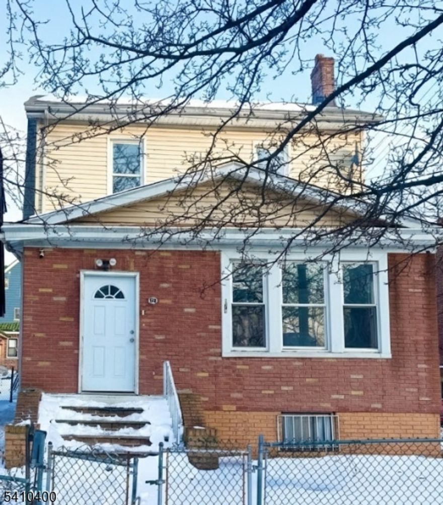 Huge corner lot single-family home with 3 bedrooms, 3 full baths, and an additional room. Finished walkout basement includes one full bath and ample space. Unfinished, spacious attic. Large backyard ideal for gatherings and outdoor activities, plus a 2-door garage. New furnace and new water tank. Conveniently located near major highways and parkways, restaurants, and shopping centers. Walking distance to the NJ Transit bus stop and Bus 107 to New York. Home needs TLC, ideal for investors and buyers looking to add finishing touches. 203K, cash, or conventional loans only. Buyer is responsible for CO, fire, and all city requirements. Seller will not make any repairs. The house is vacant.