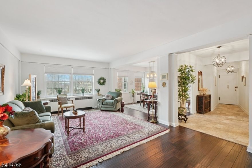 An exceptional offering at Montclair's iconic Rockcliffe, Unit 1A is a beautifully sun-filled residence that blends timeless elegance, generous proportions, and effortless first-floor living in one of Montclair's most cherished settings. This 2-bedroom, 2-bath home features high ceilings, wonderful east-and-west exposure for natural lighting, and a gracious layout that includes a spacious living room, formal dining room, and eat-in kitchen, ideal for everyday comfort and entertaining. Hardwood and gorgeous stone floors run through the living spaces, while preserved herringbone floors add lasting character. Two renovated baths, along with electric and plumbing upgrades completed in 2018, offer modern peace of mind while honoring the home's elegant style. A full walkout building basement level includes a convenient laundry room. Enjoy enhanced daily living with elevator service, a staffed front desk/concierge, on-site superintendent, and inviting outdoor patio areas. A special blend of architectural charm, light, and convenience in a sought-after park-like community just minutes to NYC transit and downtown. Parking available: outdoor ($35 mo), indoor garage ($60 mo) might be a wait list. Storage units available, might be a wait list. Monthly maintenance fee includes heat, hot water, gas, sewer, trash, 24 hour concierge and security, live-in building manager, maintenance of common areas, underlying mortgage and property taxes.