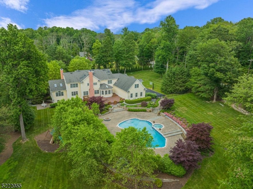 Welcome to your dream home! This luxurious property is a masterpiece of design and comfort for a lavish & relaxing lifestyle. This grand residence is nestled on a meticulously landscaped lot, boasting lush greenery and manicured lawns. Exquisite finishes and details showcase the quality build of this home. High ceilings, wood floors, picture frame and crown molding, and beautiful woodwork carvings accessorizing the three gas fireplaces in the home create an ambiance of luxury and comfort. Main level features formal Living room, Sunroom, Family room and stately wood-paneled library/office. The heart of this homes is the gourmet kitchen with high-end appliances, custom cabinetry and ample counter space. Breakfast area provides picturesque views of the amazing backyard. Adjacent dining area provides an elegant setting for formal dinners or casual gatherings. First floor bedroom with private bath. Laundry room and huge closet off the garage entrance complete the first level. Upstairs, primary suite boasts a spacious bedroom, luxurious soaking tub, private sitting and dressing area, two walk in closets Additional bedrooms each offer their own private bath. Upper level also has vast finished storage area w/9 cedar closets. Enormous finished lower-level is a versatile space with custom bar, rec room, private office, ample storage area, full bath and walk-out to a private patio. The backyard is truly an oasis for the ultimate in relaxation and entertainment, highlighted