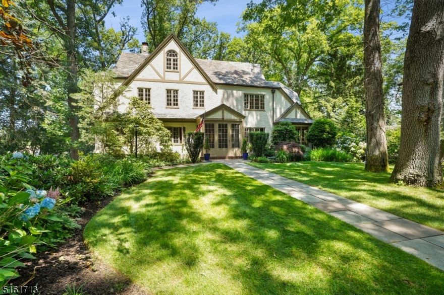 Classic  English Tudor with High-End Kitchen new in 2017.  5 Bedrooms, 4 Full and 1 half baths. New walkway, Interior freshly painter in 2022 plus exterior  painted 2021.  Great location walk to town, schools , and NY transportation.chimney/Flues ?as is? no known issues