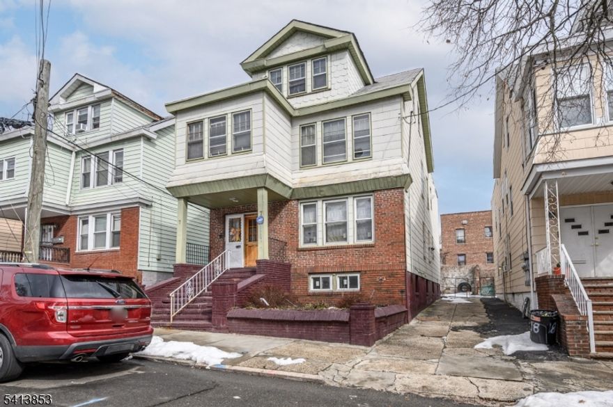 Opportunity is knocking! Spacious 3 Family Home over 3 finished levels in thriving Newark is bursting with possibilities! An ideal rental property to add to your portfolio for easy supplemental income. The first floor unit offers 2 bedrooms, 1 full bath, a kitchen, living room, and separate dining room. Plenty of natural light all through. The 2nd floor unit offers 3 bedrooms, 1 full bath, a kitchen, living room and dining room. The third floor unit offers 1 bedroom, 1 full bath, and living area & kitchen. Full basement offers ample storage, utilities, and laundry facilities. Backyard area with patio is partially fenced-in for your privacy. Semi-private entrances, separate utilities, and a prime commuter location, just steps to the bus line, easy access to major roads, close to parks, shopping, dining, Newark Beth Isreal Medical Center, and more! Don't miss out! This could be the hidden gem you've been searching for!