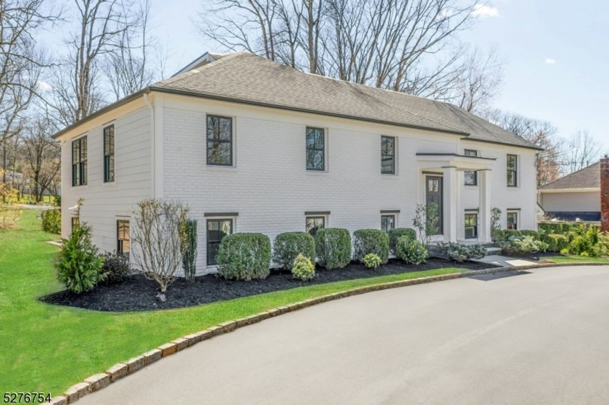 Nestled in the Deerfield section of Short Hills, this exquisite residence emerges as a beacon of luxury and architectural elegance. A meticulous renovation with everything new has encapsulated the essence of modern luxury living, offering sophisticated style across its multi-level layout. The front elevation reveals a circular drive and stunning facade characterized by a harmonious blend of contemporary design elements and classic materials. Upon entry, one is greeted by a grand foyer that flows into a thoughtful layout that is as functional as it is flexible, offering multiple office and lounge spaces. The heart of the home is undoubtedly the gourmet kitchen, which opens to a spacious dining area and sun-drenched living room, ensuring every meal is memorable. The adjacent breakfast room and expansive deck offer serene views of the grounds, providing an idyllic backdrop for both indoor and outdoor dining and relaxation. The private quarters consist of a luxurious primary suite with office, spa-like bath and expansive walk-in closet, offering a sanctuary of peace and tranquility. Additional bedrooms across three levels are each designed with careful attention to detail, offering ample space for all, including a loft and bedroom suite on a new upper level and two bedrooms, or a versatile bedroom and family room, on the ground level. With its prime location, exceptional craftsmanship and attention to detail, this is a truly remarkable property for the most discerning buyer.