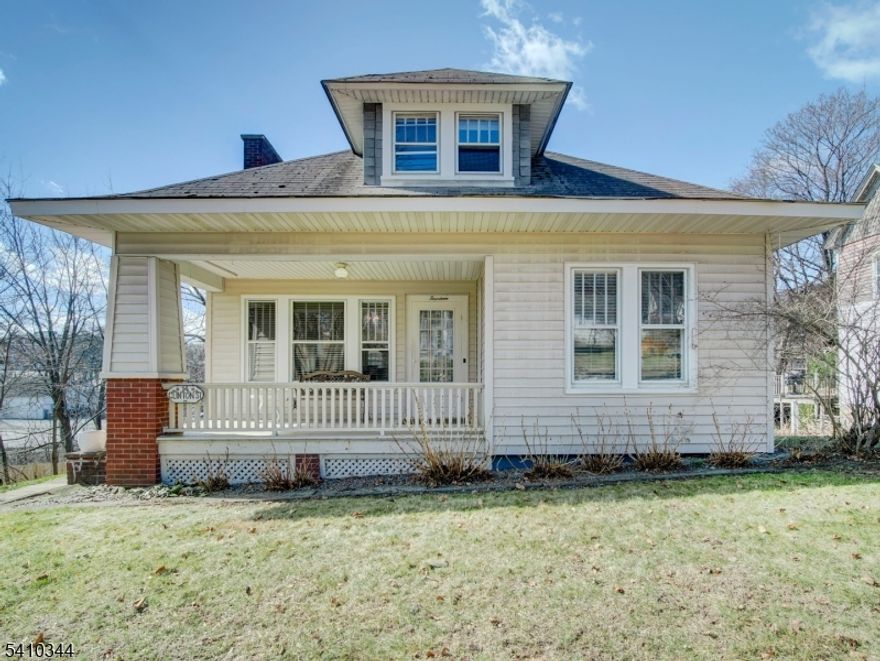 Great opportunity to own this well maintained ranch style home. You are welcomed by the charming & inviting open front porch - perfect for relaxing mornings, evening unwinding, or greeting guests in style. Enter the comfortable living room in this traditional ranch home, where a brick fireplace creates a cozy focal point and a sense of timeless charm. Built-in shelving lines the walls, adding character and practical storage while creating an ideal space to showcase books, collectibles & other decor.  A spacious dining room sits just off the kitchen, creating an easy flow for everyday living and entertaining. The kitchen features a breakfast bar, a functional layout, stainless steel appliances & hood, offering a simple yet well-maintained space. The home features an open concept layout, allowing for a seamless flow between the main living spaces ideal for both everyday living and entertaining. Off the kitchen, a practical mudroom area offers direct access to the backyard, a food pantry for extra storage, and interior access to both the basement & garage adding everyday convenience. The mudroom has washer and dryer hook up behind hall tree/bench. The functioning laundry area is presently in the basement. All appliances are included. Roth oil tank in basement. Bonus is there is gas line in street. Conveniently located mins to shopping, restaurants and center of town. A great opportunity like this doesn't come often don't miss your chance to own this home!