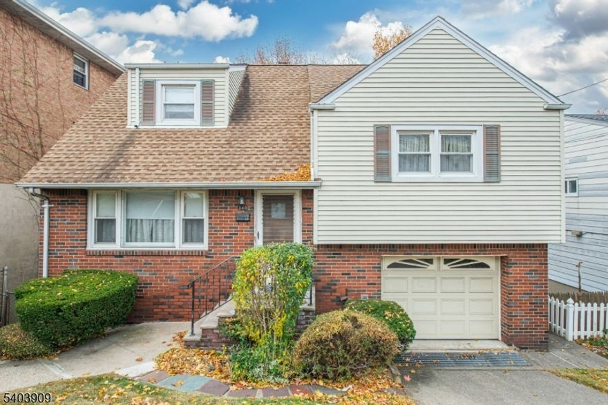 This is your chance to move into Palisades Park! Welcome to 340 Northwood Way. As you enter the living room of this split level home you get that home feeling. Living room opens to your dining room that is open to your kitchen. Step down a few stairs and you have a HUGE pantry closet that also opens to your one car garage. Step down to the basement that is ONE OF A KIND! 20 FT Ceilings, dry bar and could be used for so many uses that opens to a killer screened in rear porch! Step upstairs to two nice size bedrooms, one full bath and up a few more stairs to your third bedroom that has access to the attic. NOTE: Retaining Wall and Steps on the side of home are loose and/or cracked USE CAUTION!! Home is being sold in as is condition. All this and in a town that is so close to NYC! Don't wait before it is gone!