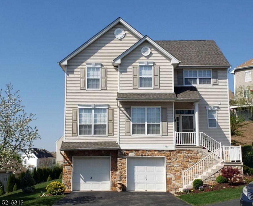 Situated on one of the most beautiful and desirable lots in Woodfield, this Ashwood model will impress the most discriminating buyer.  This 4 Bedroom, 2.1 bath Colonial has gleaming hardwood floors throughout the first level with engineered hardwood on second level.  This model is sun filled and with a great flow for entertaining.  The family room features gas fireplace with custom wood mantle and marble surround.  Spacious Kitchen with granite, SS appliances and access to rear yard through new sliding glass doors.  Second level MBR suite with newly renovated luxurious master bath/jacuzzi; vaulted ceiling and his/hers closets.   Beautiful rear yard with seasonal plantings, panoramic views and privacy!  Community amenities include swimming pool, basketball, baseball, tennis courts and playgrounds - a wonderful lifestyle awaits!!  Easily accessible to Routes 46 and 80.