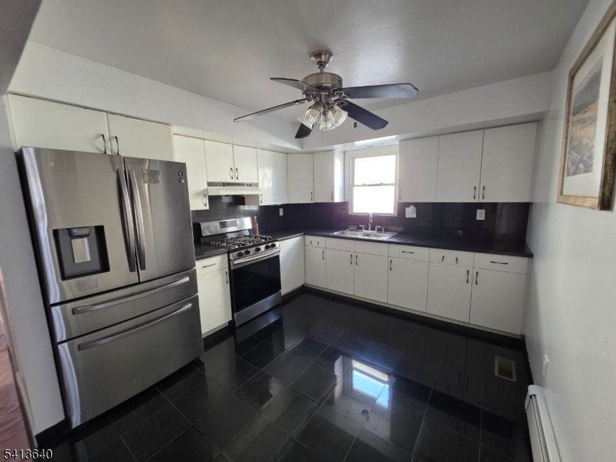 Enjoy comfortable living in this well-kept first floor 3 bedroom 1 bathroom apartment in Belleville. Hardwood floors run throughout the home, complemented by a generous living and dining space that's perfect for relaxing or entertaining. The kitchen has been updated with modern countertops and backsplash. Tucked away on a quiet street with on street/permit parking yet just minutes from shopping, public transportation, and the Garden State Parkway, this home offers the perfect balance of peace and convenience.