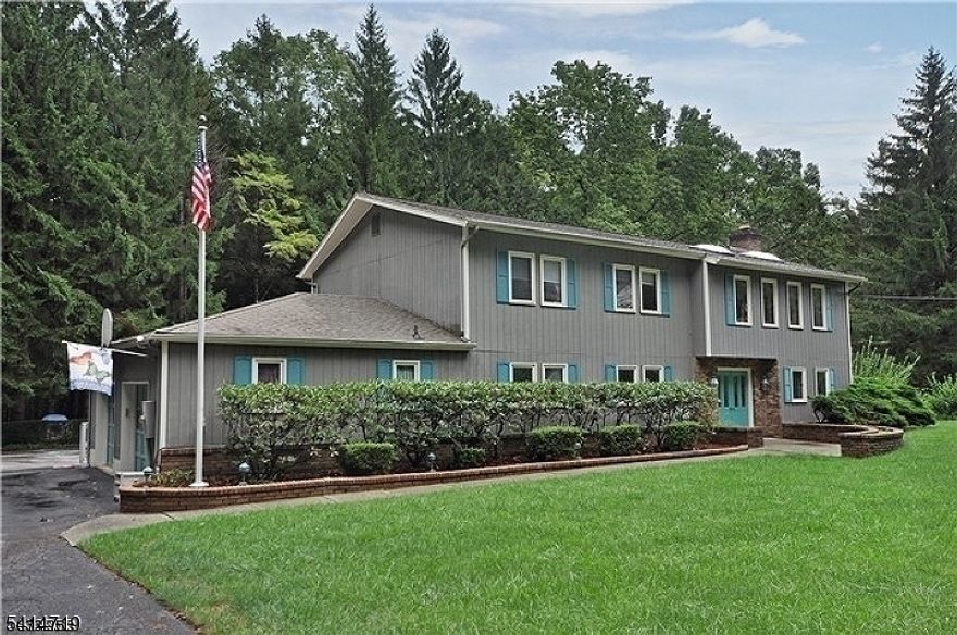 Mother/Daughter potential in Randolph, 4772 sf home on 1.41 acres, set back from the road. The main living space is on the second floor and has 3 bedrooms, 2 full baths, living room, family room w/gas fireplace, formal dining room, kitchen w/separate dining area, office, laundry closet, & access to the 2nd floor deck. The first floor has a rec room w/wood burning insert fireplace, game room, multi-purpose room currently used as an office and gym, full bathroom, 3 powder rooms, potential bedroom, kitchen & deck. There is a partial, unfinished basement for storage, fenced in yard area backing to the woods, a large driveway w/plenty of parking and a 2 car garage. Close to schools, shopping and transportation.