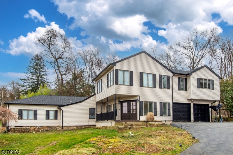 Nestled on a quiet street in Montville Township, this property epitomizes refined elegance & contemporary luxury. Beyond the new double doors lies an expansive foyer, where refinished stairs adorned w/ wrought iron banisters make a striking statement. A free-standing wood-burning stove adds warmth & charm to the living room w/ plenty of natural sunlight. The dining room has a custom wood ceiling & glass sliders providing easy access to the deck. The heart of this custom home is its brand-new gourmet kitchen, boasting high ceilings, a center island w/ seating, a separate eating area, & top-of-the-line appliances including an oven range w/ custom hood & pot filler. A walk-in pantry and all-new flooring add practicality and style. The kitchen seamlessly transitions into a bright & airy family room offering a perfect space for relaxation & entertainment. A powder room & laundry room provide convenience on the main level.  Upstairs, the master suite beckons with a balcony overlooking the tranquil backyard oasis, complete w/ a stall shower, jetted tub, 4 closets including his/her walk-in closets providing plenty of storage. 2 additional spacious bedrooms & a fully updated bath complete the 2nd floor. Outside, the backyard offers a private retreat w/ a gunite pool, multiple seating areas & deck. Perfect for a serene backdrop for outdoor gatherings & relaxation. This residence harmoniously blends sophistication w/ comfort, offering a truly exceptional living experience.