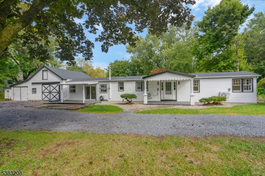 One of a kind, 3/4 acre property with a beautiful, newly renovated, ranch home, that backs up to the Towpath and is within 2 minutes of the quaint and vibrant Frenchtown NJ!!  You can not beat this location! This lot has beautiful mature trees, a fire pit, a swing, a patio, a shed, a chicken coop, and is very private for the new owner to enjoy. The home  renovated in 2025- new roof, new siding, new gutters, new engineered floors, new ss appliances, kitchen and bathroom are redone, fresh paint job, and new mini splits for heat and ac. A huge attached garage with oversized bays, boasts a full flight of stairs to second floor storage, and has a stove for heat-it is any hobbyist's dream! This area could potentially become more living space for the house, an apartment, or a shop later. Public water and public sewer! This property is a gem!