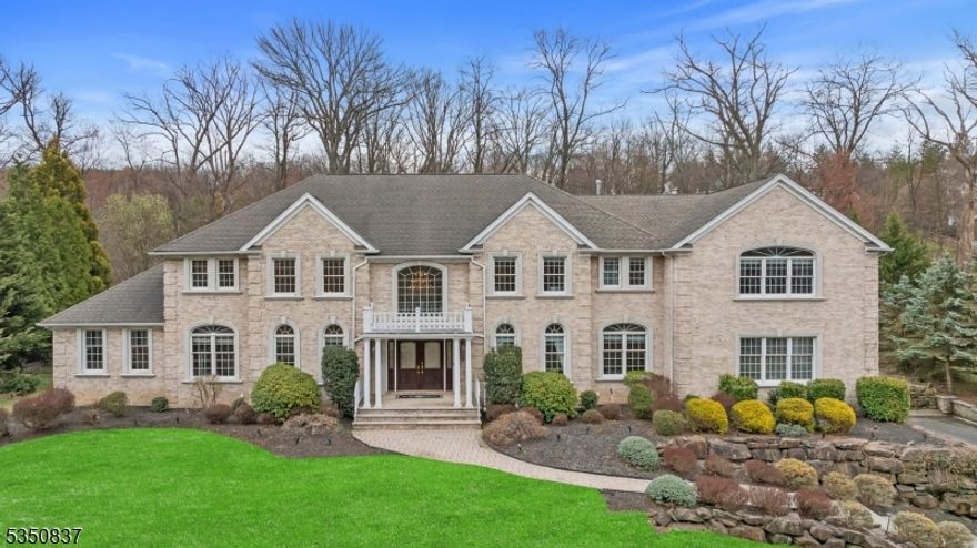 Step into sophistication with this stunning 5,400+ sq. ft. estate, where timeless elegance meets modern comfort. A grand 2-story foyer w/marble flooring sets the stage for this remarkable home. To the left, a soaring 2-story formal living room and a refined office w/ a gas fireplace create an inviting atmosphere. To the right, a formal dining room awaits, perfect for hosting elegant gatherings. The chef's kitchen is a masterpiece, featuring high-end appliances including a Sub-Zero refrigerator, double wall ovens, a gas cooktop w/ a warming drawer, 2 dishwashers, and a separate beverage center with a sink. Adjacent is the expansive great room, warmed by a double-sided gas fireplace, leading seamlessly into the conservatory adorned with double French doors, a tray ceiling, and access to the private patio. Entertainment flourishes in the family room over the garage, a spacious retreat plumbed for a wet bar. The first floor also includes a bedroom, a full bath, a powder room, a laundry room, and newer Brazilian hardwood flooring throughout. Upstairs, the primary suite is a sanctuary, offering a private office space, gas fireplace, a walk-in closet, and a newly renovated spa-like bath w/marble finishes, dual sinks, a soaking tub, and an oversized stall shower. 3 additional bedrooms each w/en-suite baths, and a second laundry room to ensure ultimate convenience. Every detail of this exquisite home is designed for comfort and style. Don't miss the opportunity to make it yours!