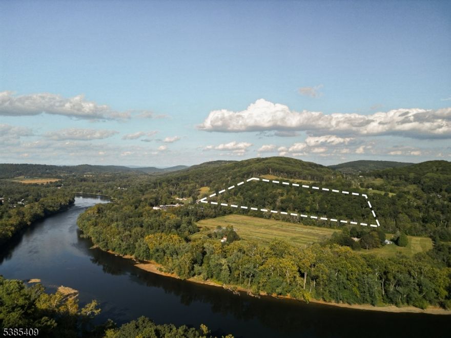 13.54 acres sits perched just beyond the Delaware River, offering sweeping views and serene seclusion. Near to quaint river towns like Frenchtown and Milford. Land slopes up from road. Mature trees, and ample sunlight make this land perfect for an imaginative custom home and private escape. Possibility of subdividing, R-5 (Residential 5-Acre) district requires lots of 5 acres or greater for detached single-family residential homes. Buyer to verify subdivision potential and utilities.