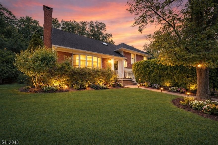 Beautifully renovated in 2024, this exceptional home offers a rare opportunity to step into a space where every detail has been thoughtfully designed for comfort, connection, and everyday enjoyment. Set on a beautifully landscaped property, the home immediately welcomes you with warmth, natural light, and a sense of quiet refinement. Inside, oversized windows fill the expansive living room with sunlight, creating an inviting setting for both lively gatherings and peaceful moments. The fully renovated kitchen, appointed with custom cabinetry, granite countertops, and stainless steel appliances, flows effortlessly into the dining area and a stunning vaulted sunroom/family room. Surrounded by windows and overlooking the private backyard and expansive paver patio, this remarkable space becomes the natural center of the home perfect for entertaining, relaxing, and creating lasting memories. The upper level offers a spacious primary suite designed as a true retreat, complete with multiple closets and a beautifully renovated bath with a skylight. Additional bedrooms and a dedicated office provide flexibility for evolving needs. The finished lower level with a full bath offers versatile space. Outside, the private backyard invites outdoor dining, gatherings, and quiet evenings. Extensive renovations, including a new roof (2026), provide peace of mind and true move-in-ready convenience. A rare chance to settle into a beautifully finished home on one of the most sought-after locations.