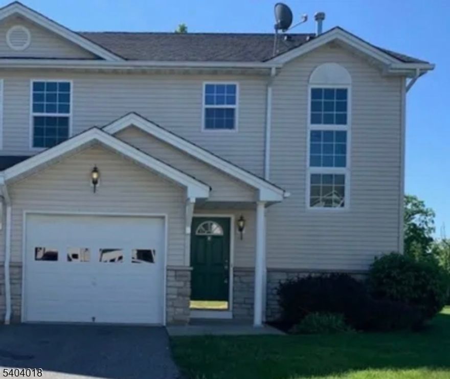 Welcome home to this bright end-unit townhome in Ridgefield Commons. Enjoy the ease of an open-concept first floor, featuring a spacious kitchen that flows into the living and dining areas, with sliding doors leading to a private patio perfect for relaxing or entertaining. A welcoming foyer, ample storage closets, and a convenient powder room complete the main level.Upstairs, you'll find three comfortable bedrooms and two full bathrooms, including a primary suite with its own private bath. A dedicated laundry room is also located on this level, allowing tenants to install their own washer and dryer.Tenants will have access to a one-car attached garage plus driveway parking for added convenience.No pets, please.