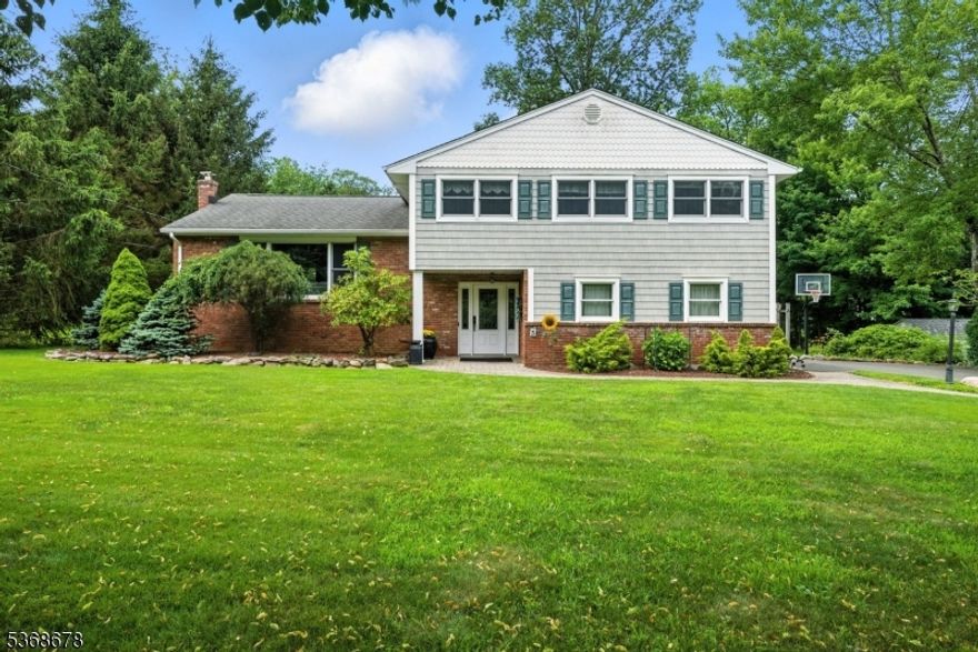 A beautiful home awaits you in this quiet, Union Hill neighborhood! Desirable, low turnover street with curbs. Offering almost 2,200 sqft of living space across 3 finished floors & an absolutely perfect floorplan. The living room is full of light and boasts a stunning corning gas fireplace which opens to the spacious dining room. Lovely hardwood floors and tile flooring. The large eat in kitchen features superb granite counters, gourmet SS appliances, excellent cabinet space & a peninsula with room to sit. Upstairs offers the primary suite with a full bath & walk-in closet. 3 additional generous sized bedrooms & a full bath complete the 2nd floor. Ground level boasts a foyer, family room with cozy wood burning stove, a powder room, laundry & walkout to back paver patio. Bonus sun room expands the living indoors & out. TONS of storage in unfinished bsmt & 2 car garage. Trex deck off the dining & a hot tub. Public utilities, reasonable taxes, top rated schools, close proximity to Downtown, Union Hill shops & Morristown's top restaurants & shows, bus & train direct into NYC, and easy access to all major highways. Totally Move-In-Condition. Just unpack & begin to enjoy on day one, all this home, neighborhood & Denville have to offer.