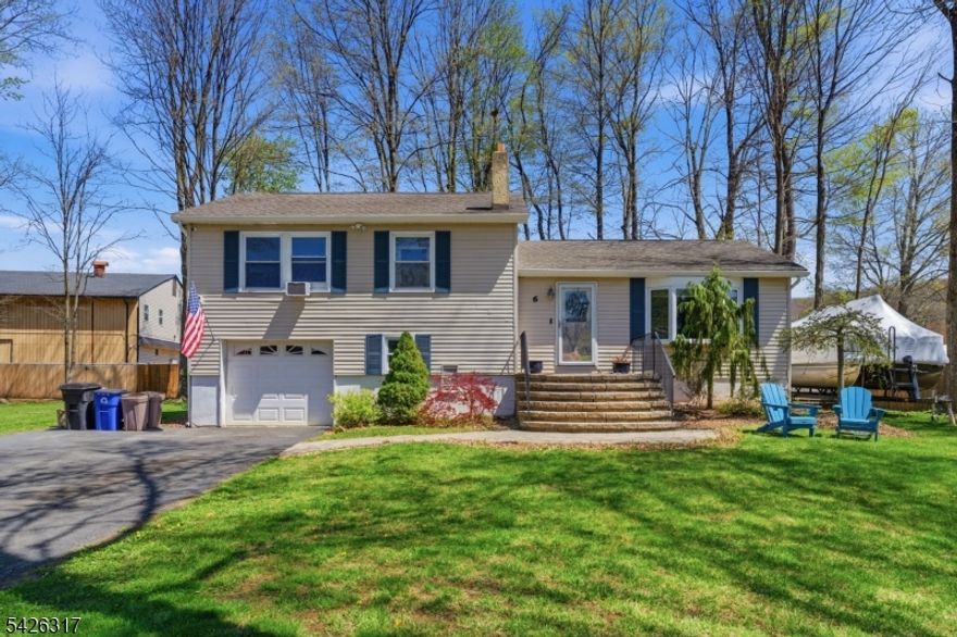 Welcome to 6 Woodport Ave in sought after Lake Hopatcong! This beautifully maintained 3-bedroom, 2.5-bath split-level home offers the perfect blend of comfort, style, and location. Inside, enjoy a bright open layout with a spacious living room, updated kitchen featuring granite countertops, stainless steel appliances, and a large center island ideal for entertaining. The home also offers flexible living space perfect for a home office or family room. Step outside to a large, level backyard with room for expansion or a detached garage, plus a deck for relaxing and outdoor gatherings. The standout feature is deeded lake access, including an available dock slip just a short walk away, perfect for boating and enjoying the lake lifestyle. Conveniently located near restaurants, shopping, commuter routes, and NJ Transit. Close to parks, playgrounds, tennis and basketball courts, and hiking trails. A true move-in-ready home offering the best of Lake Hopatcong living!