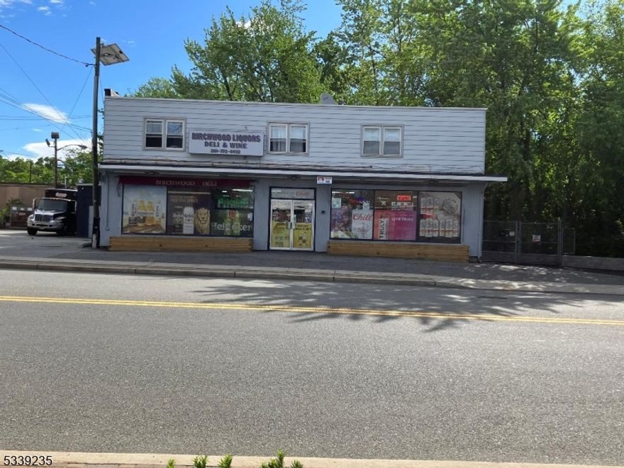 This mixed-use property is centrally located between several major highways, Route 80, Route 46 & Route 4 as well as the Garden State Parkway! Includes a commercial ground floor unit, currently rented since 2001 for $$6,250/m-m, as a liquor store/deli, lottery, etc. 2nd floor 3/2 apartment, could be for owner or to rent for $2800 m-m + 11 car parking for commercial unit and up to 6 car parking for rental apartment which includes 3 bedrooms, 2 baths, laundry, living room, dining room and eat in kitchen. Kitchen and baths in the apartment have been updated, new appliances. Separate utilities, 1 water bill split between 2 units. Central air in commercial unit, window units on 2nd floor. Driveway for commercial unit was re done in 2020. Rental apartment driveway and retaining wall were re done in 2024. Electrical panels were updated in 2022. Building Insurance, $6,600/yr.