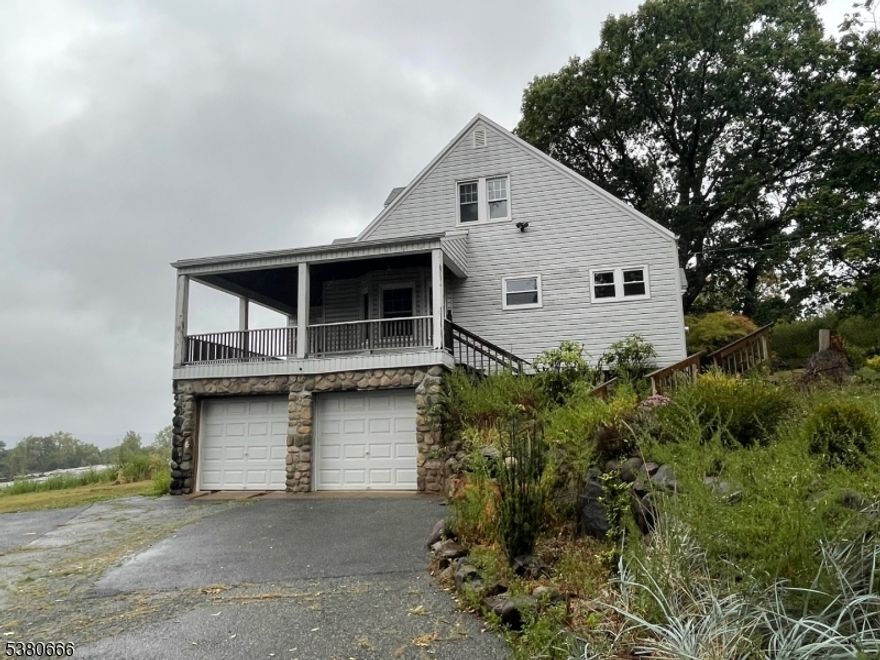 The house sets back behind the Garden center on Hamburg Turnpike Renovated in 2025 with new kitchen and bathroom. Hardwood floors on first floor. The finished walkout basement has  family room, full bathroom and laundry room .