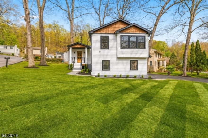 Totally renovated home with an open floor plan and top-quality craftsmanship, ideally located in the sought-after Rock Ridge Lake Community in the heart of Denville. This beautifully updated home features a spacious, light-filled layout perfect for modern living and entertaining. The stunning kitchen offers quartz countertops, a built-in table, and stainless steel appliances. The primary bedroom ensuite is a private retreat with two walk-in closets and a luxurious bath featuring a double vanity. The ground-level walkout finished basement provides additional living space, ideal for a family room, recreation area, or home office. A spacious 2-car garage adds convenience and ample storage. A rare opportunity to enjoy stylish, move-in-ready living in one of the area's most desirable lake communities.