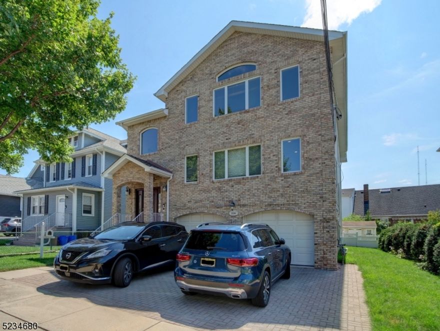 Renovated, beautiful first floor, 3 bedroom, 2 full bath apartment in a 2-family home on a quiet residential street.  Huge living room, dining room, gorgeous kitchen with cream-colored cabinetry & granite countertops. New hardwood floors throughout. Primary bedroom complete with huge walk-in closet and full private bath with high-end tile. Two additional spacious bedrooms, tons of closets and recessed lighting throughout. Shared, full sized washer & dryer on lower level. Landlords are moving out August 10th and home will be in perfect shape for new tenants.  Pet friendly here! Terrific neighbors! Left side of garage space available. Shared use of bbq, fenced-in backyard and shed is also available. Public utilities--water is billed flat rate of $125/quarter and electric is $175 month.  Landlord covers lawn maintenance & snow removal.  Super close to NYC bus and train. Owners are NJ licensed Realtors. RENTAL REQUIREMENTS: NJAR application, NTN report, employment verification. Credit score of at least 670 and income 3:1 to be considered. Tenant responsible for first $250 of repairs and tenant's insurance required.  Landlord will provide lease.