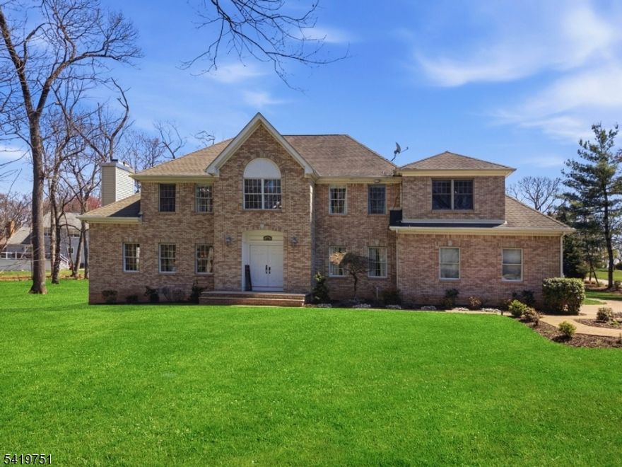 Set in Woodshire Estates, one of Montville's most desirable sections, this impressive 5 bedroom, 3.5 bath colonial offers space, design, and a layout that works. A grand 2 story entry welcomes you in and sets the tone for the scale and light found throughout the home. The bright kitchen features a commercial-grade 6 burner range, pot filler, warming drawer, and high end finishes. The dining room makes a statement with a custom lighted drop ceiling, while hardwood floors and recessed lighting flow throughout the home. A large formal living room with gas fireplace adds to the generous main level layout. Added convenience of a first floor bedroom off the kitchen, which can be used for an office, or enjoy the added storage, perfect for organization. Upstairs, the primary suite offers a rare setup with a huge walk-in closet, private gym, and a spacious laundry room, all within the suite, along with a stunning bath. All bathrooms throughout the home are finished with gorgeous design. Custom closets are featured in all second floor bedrooms. The finished basement with a full bath adds flexible space for recreation, work, or guests. Outside, the large backyard is open, spacious, and ideal for both relaxing and entertaining. With five bedrooms, beautiful finishes throughout, and a long list of features, this is a home that needs to be seen in person to fully appreciate. EV charging station, generator, upgraded 200 amp electric, indoor/outdoor speakers, & Verizon Fios available.