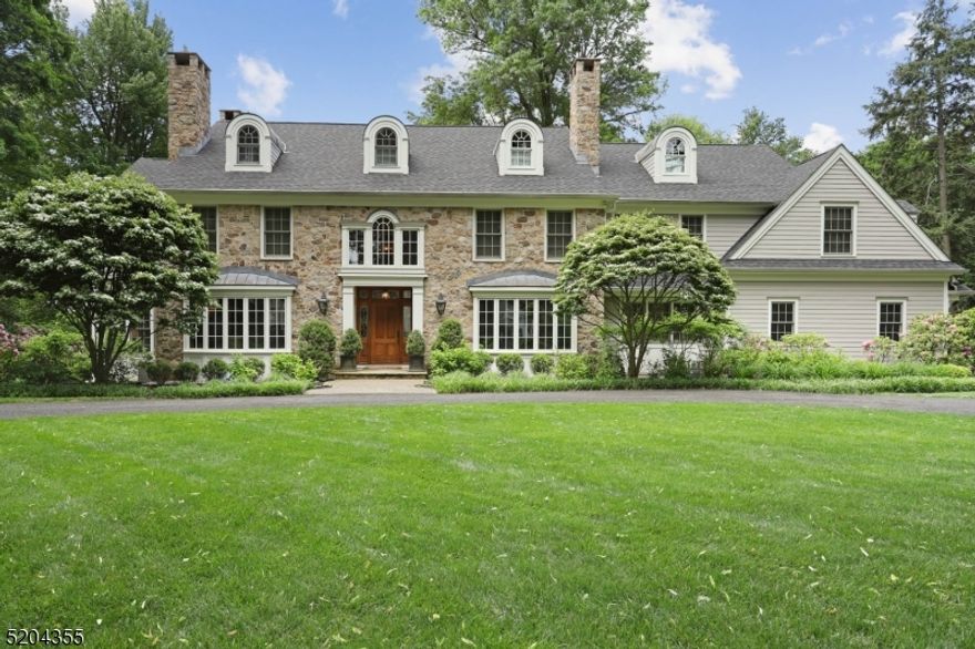 Gorgeous CUSTOM Colonial nestled on 3/4 of an acre on one of Chatham's most beautiful and desirable streets. The home designed with style and sophistication blends modern & traditional elements to create a sophisticated, spacious floor plan. Noted architect Al Bol generously incorporated high end architectural details including curved archways and dormers, coffered ceilings, intricate moldings, wainscoting, & transom windows that maximize the desirable Southern Exposure. A two-story foyer is flanked by formal DR & LR with fireplaces. The designer kitchen features a Subzero, a Viking range & additional wall oven, an oversized walk-in pantry, breakfast room, a 'command center' & flows gracefully into a spacious Family room. The FR features a fireplace, custom built ins & a French door that leads directly to the sunporch & outdoor covered porch overlooking the Hot Tub, built in fire pit & prof landscaped fenced private backyard. 1st floor includes a bedroom/study, a smartly designed mudroom w/lockers, back staircase, full bath & direct access to the 3-car attached heated garage. Primary Bedroom has a fireplace, dual walk-in closets, a dressing area & luxe Bath.  2nd flr has 4 ensuite bedrooms, two feature private ensuite baths, the other two have direct access to a shared bath. Laundry on the 2nd flr. The finished 3rd floor has a bedroom, full bath & large closets. The finished basement offers a multitude of rooms including Billiards, Media, Play, Craft, Wine, & Exercise rooms.