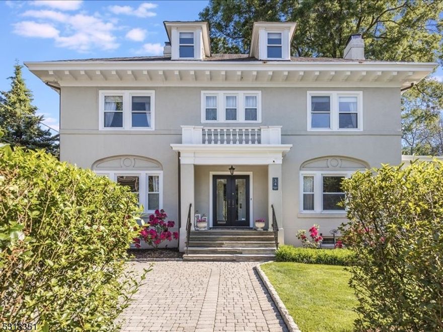 Elegant. Expansive. Exceptional.  A quick stroll from Montclair's dynamic downtown, this sophisticated manor home is a true gem brimming with meticulously crafted, stunning details from top to bottom. The stately center entrance provides the perfect introduction to the grand foyer w/ gorgeous leaded glass & glimpses into the rooms beyond. The living & dining rooms are both showstoppers each with fireplaces surrounded by beautiful oversized mantles. The stunning LR has a magnificent beamed ceiling while the DR features 2/3 wainscotting & leaded glass French doors & windows. The family room is a sunny & relaxing spot while the music room with its fireplace & access to the yard is perfect for a quiet read or a great staging spot for outside entertaining. The kitchen boasts 2 pantries, ceiling height cabinets, marble counters, center island & top of the line appliances.  A mudroom & powder room complete this level. The 2nd fl landing showcases a truly impressive leaded glass window that opens to a sweet patio overlooking the yard.  There are 4 BRs including a primary suite with a fireplace, full BA &  WIC, 3 additional BRs & a full BA. The 3rd fl offers the 5th & 6th BRs, a full BA plus a large media/flex space with a fireplace. The backyard is vast & well-manicured, surrounded by mature landscaping & offering a large patio & so much space to play, relax & entertain.  More than a home - this is a lifestyle that combines comfort & sophistication with a vibrant urban experience.