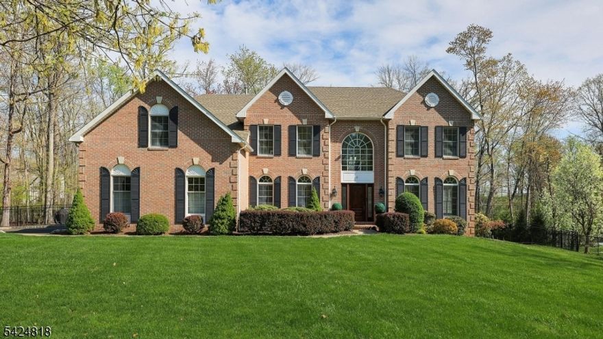 This home offers a rare balance of space, style & practicality in a setting that's both private & convenient. Situated on a quiet cul-de-sac, it provides a peaceful atmosphere with minimal through traffic, while still being just minutes from Hwy 78-making daily commuting simple & efficient. The 2024 renovations bring a fresh modern feel to a classic Colonial layout, giving buyers the benefit of updated spaces without sacrificing character. Bright, sun-filled interiors, a dramatic two-story foyer & timeless details like hardwood floors & wainscoting create an inviting environment that feels both elegant & comfortable. With five generously sized bedrooms & the flexibility for two additional bedrooms on the lower level, the home offers exceptional versatility. A main-floor bedroom with its own full bathroom provides an ideal setup for guests, offering comfort & privacy without impacting the upstairs living spaces. Whether the need is for extra living space, guest accommodations, a home office or hobby rooms, this layout adapts easily.  The primary suite's bonus sitting area or office adds another layer of functionality for today's lifestyle. The lower level features a recreational and playroom area, providing additional space for leisure, activities or gatherings-ideal for creating a separate zone for relaxation or entertainment. The fully fenced backyard with a large deck extends the living space outdoors, offering a perfect setting for entertaining or enjoying quiet moments.