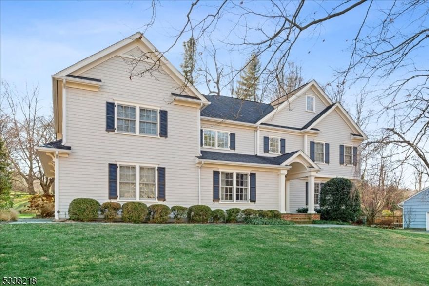 The wait is over! Come see this fabulous 5-bedroom, 4.5-bath colonial, completely rebuilt in 2008, offering spectacular space across all levels. The first floor boasts a spacious kitchen with high-end stainless steel appliances, an oversized island, a separate dinette area, walk-in food pantry, butlers pantry and a formal dining room. The expansive family room features a gas fireplace and abundant natural light, creating a warm and inviting atmosphere. Additional highlights include a mudroom, powder room, a two-car garage, and a highly desirable first-floor office/bedroom with an ensuite bath. Upstairs, the second floor offers four generously sized bedrooms with expansive closets, each with either an ensuite or a Jack-and-Jill bath. The sophisticated primary suite impresses with soaring ceilings, 2 walk-in closets, a luxurious full bath with a soaking tub, heated floors, a marble-tiled shower, and a private water closet. A walk-up third floor provides easy access to an unfinished space, perfect for customization. The finished lower level includes a large recreation room, an exercise area, and a utility room, adding even more functional space to this remarkable home. Don't miss this exceptional opportunity! Home includes a full house generator, security system and and electric car charger in the garage. Fireplace sold AS IS with no known issues.