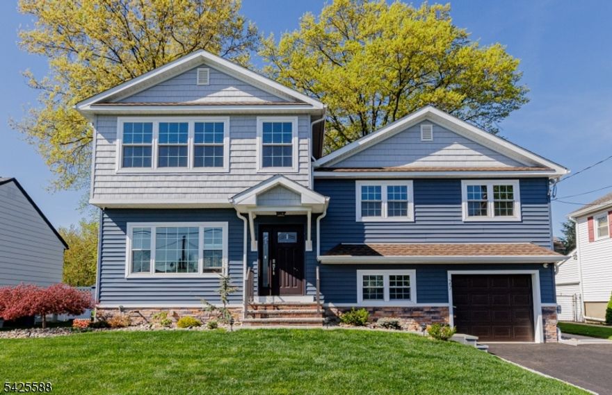 Ready to move in to this 4 Bedroom, 2.5 Bath, extra Rec. room and covered porch-3 season room nicely done with western red cedar ceiling, completely newly renovated and updated split level in 2020, located on quiet one way street with Cul-de-sac  behind the backyard for privacy, close to shopping stores and NJ bus to NYC.Tankless Gas High Efficient Water Heater 2020,Solid Maplewood Kitchen cabinets, 2 New independent HighEfficient HVAC installed in  2020, remaining manufactured warranty until 2030.New windows, roof, siding in 2020.Entire House has new electrical wiring with 200AMP Service and new water and gas lines.Entire house has new insulation in 2020, basement interior foundation waterproof painted.New Driveway and landscape Lighting done 2025. Patio 2023. Sound system through the parts of the house and backyard.Finished insulated basement with heat and AC.Garage door and opener 2024. Security cameras with view around entire house.Hardwired smoke and carbon monoxide detectors.This home has it all and is opportunity to own great House in a great location close to top rated schools.