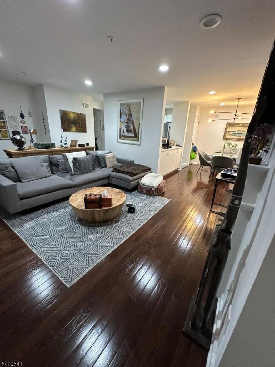 Location, location location! Totally renovated to perfection 2 bedroom, 2.5 bath condo on 1st floor. Enter to huge grate room with new hard wood floors and gas fireplace, dining room, brand new kitchen with stainless steel appliances & granite countertops with new tile floor and backsplash, huge pantry and beautiful powder room. Go downstairs to your office with a sliding door to newly painted Balcony with scenic views of the trees and lush landscaping. Enter your primary bedroom with another sliding door and adjacent full bath with tub/shower. 2 closets in primary bedroom. Then go downstairs to your finished walk-out basement with slider to patio and luxury vinyl floors including laundry room with washer & dryer for convenience. Enter another bedroom with full walk-in shower with dual chrome rain shower heads with handheld wand and bench. Dimmable recessed lighting throughout. Incredible community amenities such as pool, clubhouse, gym, tennis court/pickle ball, newly paved streets in the private/quiet neighborhood. Private attached garage with entrance to the unit. Nest thermostat, new windows, new sliding doors with recently replaced gas furnace & water heater. Prime location for commuters close to NYC, major hospitals, South Orange train station, Turtle Back Zoo, shopping, and restaurants.Renter pays for water & sewer, gas, electric, internet, and cable. All utilities are responsibility of renter. Renters insurance is required. Pet friendly. Pet must be trained.