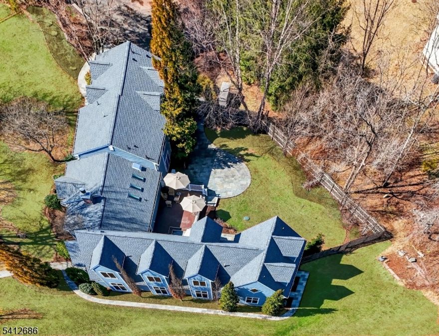 Set in a desirable Montgomery Township location with a Princeton mailing address, this expanded and updated split-level residence offers approximately 2,400 square feet of comfortable main living space, seamlessly complemented by an exceptional 3,800-square-foot addition designed for grand-scale gathering, and celebration. The open-concept main home features three to four bedrooms, airy living and dining areas - vaulted, sky-lit ceiling in the kitchen with commercial appliances and upscale finishes that support everyday living. Connected to the residence, the remarkable 50-foot-long entertainment space introduces a rare opportunity: a dramatic, acoustically enhanced space equally suited to large family celebrations, musical performances, cultural festivities, art display, or studio-style creative pursuits   all within the privacy of a residential setting.A dedicated chef's kitchen allows effortless hosting for events of up to 60 guests, a glass enclosed wine cellar creates an inviting focal point for tasting and display, while a full and half bath provide convenience for large gatherings. Above the addition, a substantial upper level spans the entire footprint, offering exceptional flexibility with a private office or lounge, a fifth bedroom suite, and a home gym-ideal for guest accommodations, work-from-home, or extended living arrangements.Whether envisioned for multi-generational living,holiday celebrations or performances, the space adapts to a wide range of lifestyles.