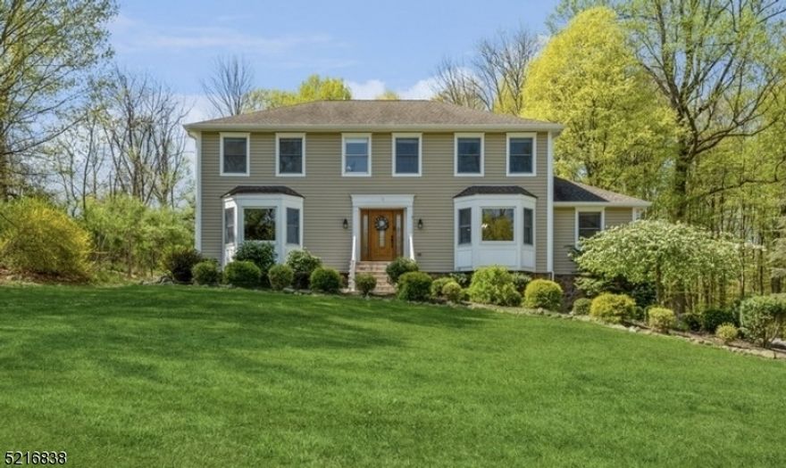 A private, light-filled haven with room for all!  Lovingly-maintained home with 4 bedrooms, 3.5 bathrooms, and an attached 2-car garage is perched on a 1.28-acre lot on a tranquil dead-end street in this scenic Warren County community. Just three miles from Route 80, this home is near shopping, dining, farmers' markets, Centenary University, and the Delaware Water Gap. Immaculate and full of upgrades, the interior offers hardwood floors, large rooms, and windows galore bringing in loads of natural light. The foyer opens to a large living room, followed by a beautiful family room with a warming fireplace and a bay window, and a formal dining room with a chair rail and plenty of space for a crowd. The open kitchen is equipped with granite counters, stainless steel appliances, rich wood cabinetry, and a sunny breakfast area. Throw open the French doors to the low-maintenance Trex deck that is ideal for entertaining. Enjoy dining al fresco as you look out on the beautifully hardscaped back yard with a huge salt-water above-ground pool and a garden shed. The main level continues to a powder room, laundry room with outside access, and a convenient office/den room. Upstairs is the primary bedroom suite with a walk-in closet and lavish en-suite bathroom, along with 3 good size bedrooms and a full hall bathroom. The finished basement level includes a large family room with a built-in bar, a new full bathroom, lots of storage, and access to the attached garage.