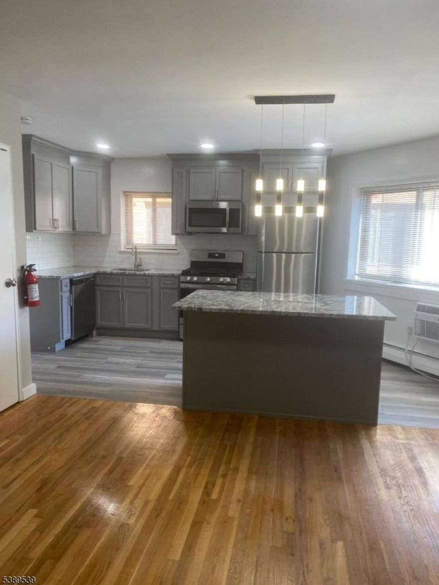 This beautiful renovated  3 bedroom 2 full bath apartment features hardwood flooring throughout, includes heat and hot water- centrally located--Walking to town, shops, restaurants and University. Great location.  Parking is not included with rent, please inquire