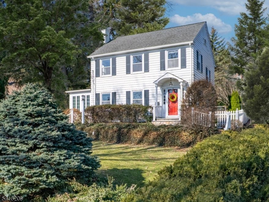 Classic colonial character, modern updates, and an unbeatable walk to town location! This meticulous 3 bed/3 full bath is move-in ready & features a very appealing layout. Inside, you are greeted by an inviting living room anchored by lots of windows & a wood-burning fireplace. The UPDATED all white kitchen features stainless steel appliances, ample cabinetry, & a convenient breakfast bar for casual dining. Sophisticated French doors open to a lovely patio, ideal for al fresco dining, summer gatherings, or a quiet morning coffee. The large dining room off the kitchen is the perfect space for everyday living & entertaining. A standout feature of the home is the gorgeous sun-filled mudroom/sunroom, offering the perfect blend of style & practicality. With abundant natural light & generous space, it serves as an ideal hub for busy households, perfect for organizing coats, backpacks, & everyday essentials while still feeling like a peaceful retreat. Upstairs, all three bedrooms are generously sized & share a large hall bath. The finished basement expands the home's versatility with a recreation room perfect for a playroom, media space, or home office. An updated laundry area, pantry closet, & abundant storage help to keep everything organized. Outside, the level & landscaped backyard provides an ideal space for play & relaxation, completing this charming property.