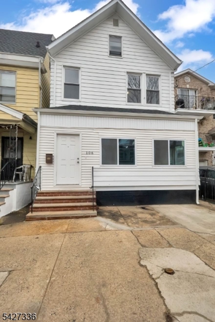 Incredible opportunity to own a large 2,000 sq ft home at a very affordable price! 106 S 11th St is  a spacious home offering impressive proportions, high ceilings, and a layout full of potential. When you enter you'll notice the airy feel created by generously sized rooms and impressive ceiling heights that enhance natural light and openness throughout. The main level begins with a large enclosed front porch that flows to a bright living area, and an updated kitchen with modern cabinetry, stainless steel appliances, quartz countertop, and clean finishes. Also on the first floor is a laundry area, full bathroom, and large primary bedroom. Upstairs, 3 well-sized bedrooms continue the theme of scale and comfort, with ample space for both everyday living and flexibility. The bathroom has been updated with a a fresh look. The full basement offers extensive storage or future finishing potential, while the backyard provides outdoor space rarely found at this price point. Ideally located just minutes from Downtown Newark, Newark Liberty International Airport, major highways, and public transportation including NJ Transit and PATH, this home offers both convenience and accessibility. A strong combination of price, size, and location makes this property a standout opportunity!