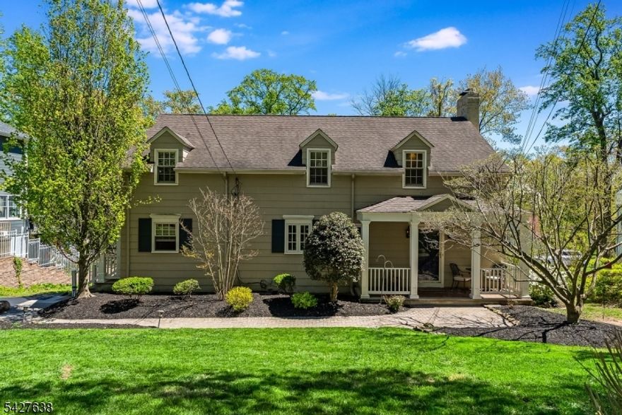 Tucked away on a quiet cul-de-sac, this beautifully maintained 3 bed/2.5 bath Colonial offers the perfect blend of classic charm and serene privacy. Set on a generously sized lot, the backyard is a true retreat - lush, peaceful and ideal for entertaining, relaxing or simply enjoying nature.  The well-appointed kitchen opens to a comfortable family room and gathering spaces to include a formal dining and living room. The  spacious entry foyer provides a stunning introduction to the home. Three generous sized bedrooms with the primary offering a sitting room area, walk-in closet and private bath.  Finished basement allows for more living space and the oversized two car garage has an abundance of loft storage. Brand new hot water heater.  Walking distance to Trailside Science Center, Loop playground and all that the Watchung Reservation has to offer.  A hidden gem in a sought after location - this is the one you've been waiting for!