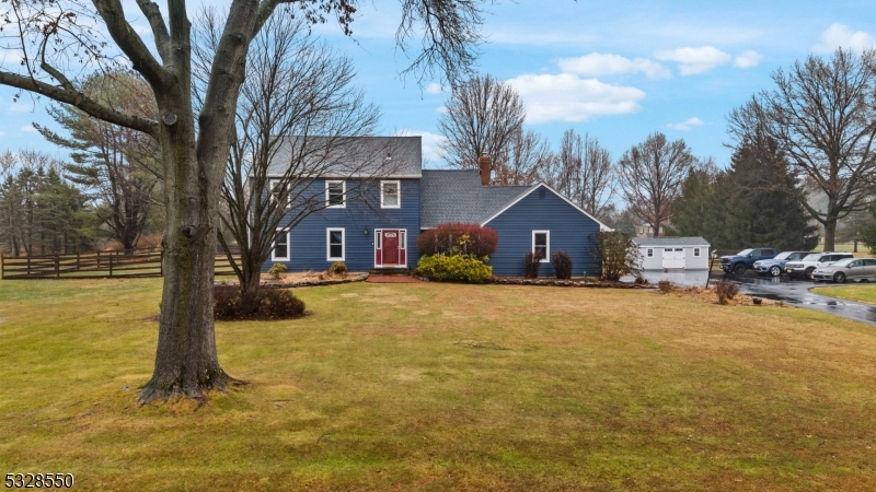 Stunning Saltbox Colonial Impeccably Maintained & Updated 4 Bdrm, 2.1 Bath Home w Lush Landscaping & Perrennial Gardens set on 1.72 Level Acres in the Desirable Cornhuskers Section, a Fabulous Neighborhood. Elegant Spacious LR & Formal DR w Hardwood Floors. Updated Powder Rm. Family Room features: Wainscoting, Brick Front WB FP w Insert & Newer Sliders to the Maintenance Free Deck & Picturesque Private Fenced Backyard w 2 Paver Patios & Fire Pit. Completely Remodeled EIK wCustom Cabinetry, Granite Counters and Upscale SS App. Second Level Offers a Large Primary Bedroom w 2 Closets and Updated Prim Bath, 3 Additional Spacious Bedrooms w Ample Closet Space & Main Bath. HW Floors Throughout & Under Carpet. Large Shed, 2 Car Attached Garage and Full Unfinished Basement.  Recent Improvements:  2019: UV Well Filter, Fencing, Wood Stove Insert in Fireplace, Garage Floor finished. 2020: Driveway, Garden. 2021: Windows (Renewal by Anderson), Water Heater, Utility Sink in Basement, Kitchen floor, Den Carpet, Water Line to Garden, 2023: Lenox Furnace, Carrier AC, Garage Doors, Shed, 2024: Siding & Roof.Top Schools:  Readington Township & HCRHS, Commuters Dream Location Min to Major Hwys 78, 287, 22, 202, NJ Transit, Park & Ride, Shops & Eateries.