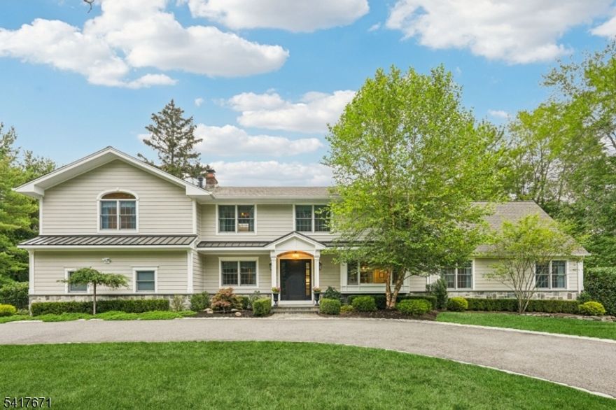 Completely updated and full of charm, this beautiful home sits on a large, wide lot with a tranquil creek and natural waterfall, and circular driveway in desirable Franklin Lakes. The first floor features a spectacular great room with spiral staircase and gas fireplace, a beautiful updated kitchen, large formal dining room, additional living room with wood burning fireplace, a three season room with creek views and two expansive decks overlooking a park-like backyard. Upstairs, the spacious primary suite offers a gas fireplace, two walk-in closets, an attached office or sitting room, and a beautifully updated custom en-suite bath with laundry.  Three additional bedrooms and a hall bath complete the 2nd floor.  The finished walkout basements provide extra recreation space and plenty of storage.  Newly Renovated, Custom Cabinets, Custom Marble Tile, High End Appliances, Hot Tub, Newer 5 bedroom Septic, House Generator, New Hardy Plank Siding, Custom Cabinets, Custom Marble Tile, High End Appliances. Owner has a NJ Real Estate License.