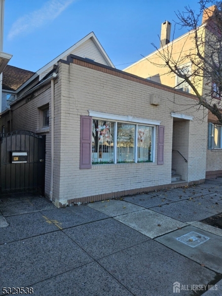 Mixed use Building featuring a Jewelry Store in front and 5- bedroom house in back with private, fenced yard. Municipal Parking lot across the street.