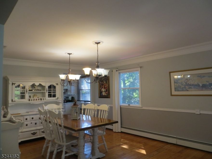 This magnificent home features many upgrades. Hardwood floors throughout, updated kitchen with quartz counters, backsplash, and SS appliances. updated bathrooms, large primary bedroom, open floor plan, crown molding, and chair rail in the dining room. Sliders to deck, and private backyard. Tenant to provide NTN report and tenant insurance. The basement is temporarily not available to tenants with the exception of the laundry room. Convenient to routes 46 and 80.