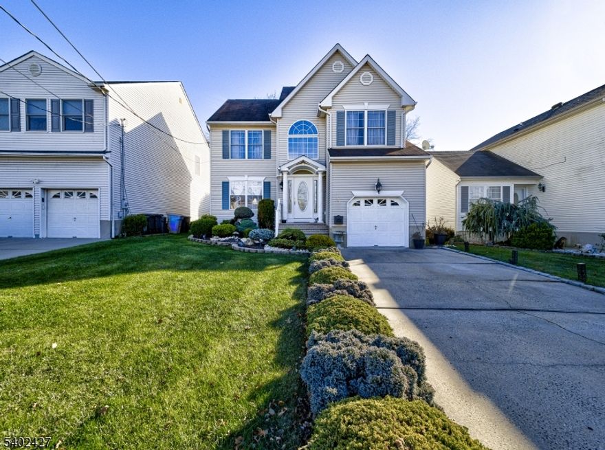 Welcome to your dream home an exceptional and rare opportunity not to be missed. This modern two-story residence is set on a spacious, fully fenced yard backing to tranquil woods, offering both privacy and serenity. Enjoy outdoor living on the beautiful paver patio, ideal for morning coffee or entertaining while overlooking the professionally landscaped grounds. Inside, the home is impeccably maintained and thoughtfully designed for comfort and elegance. A dramatic two-story foyer sets the tone, leading to formal living and dining rooms perfect for gatherings. The stunning kitchen features granite countertops, stainless steel appliances, and an eat-in area with sliding doors that open directly to the backyard. A convenient powder room is located on the first floor. Hardwood floors, detailed railings and staircases, and recessed lighting add warmth and sophistication throughout. The second floor offers three bedrooms, including a spacious primary suite, two generously sized bedrooms, and 2 full baths. The full basement provides abundant storage and the potential to be finished into additional living space, a home gym, or a recreation area. A long private driveway leads to the garage, and the home's convenient access to major highways makes commuting to NYC easy either via Bus, Train, Ferry or major highways Rt 9, GS Parkway, NJ Turnpike. This remarkable property is truly a must-see schedule your private showing today and discover all it has to offer.