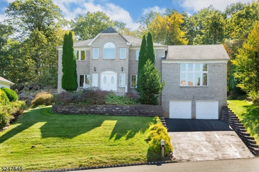 Welcome Home to 20 Emerson Drive! Situated on a beautiful piece of property in one of Morris County's most sought out, beautiful neighborhoods in Powder Mill. Enjoy several different beautiful vantage points of vast greenery this lot offers. Spacious driveway with an oversized front lawn and private backyard with patio. Enter into an oversized spacious bright and airy foyer with added light from the natural sunlight beaming through the windows in the Dining Room on the right and the Living Room on the left. French Doors make way into the Formal Dining room with another French Door making way to a breath-taking BONUS GREAT ROOM!  This room features four ceiling to floor windows granting radiant rays of sunlight into this magnificent living area.  A HUGE finished basement with a FULL Kitchen, FULL Bathroom, REC Room, ALL-PURPOSE Room and Storage Room! Bright, open Kitchen featuring white cabinetry, stunning granite countertops with stainless steel sink and tile backsplash. Formal Dining Room w/hardwood floors and tons of natural light. Family Room w/raised marble hearth. Bedrooms feature hardwood flooring throughout. Enjoy a large walk-in closet in the Master Bedroom with hardwood flooring, shelving & ceiling light. Expansive outdoor patio with access from the eat-in Breakfast area is the perfect place for endless nights of entertainment. This home truly encapsulates elegant living with peace, privacy and beauty!